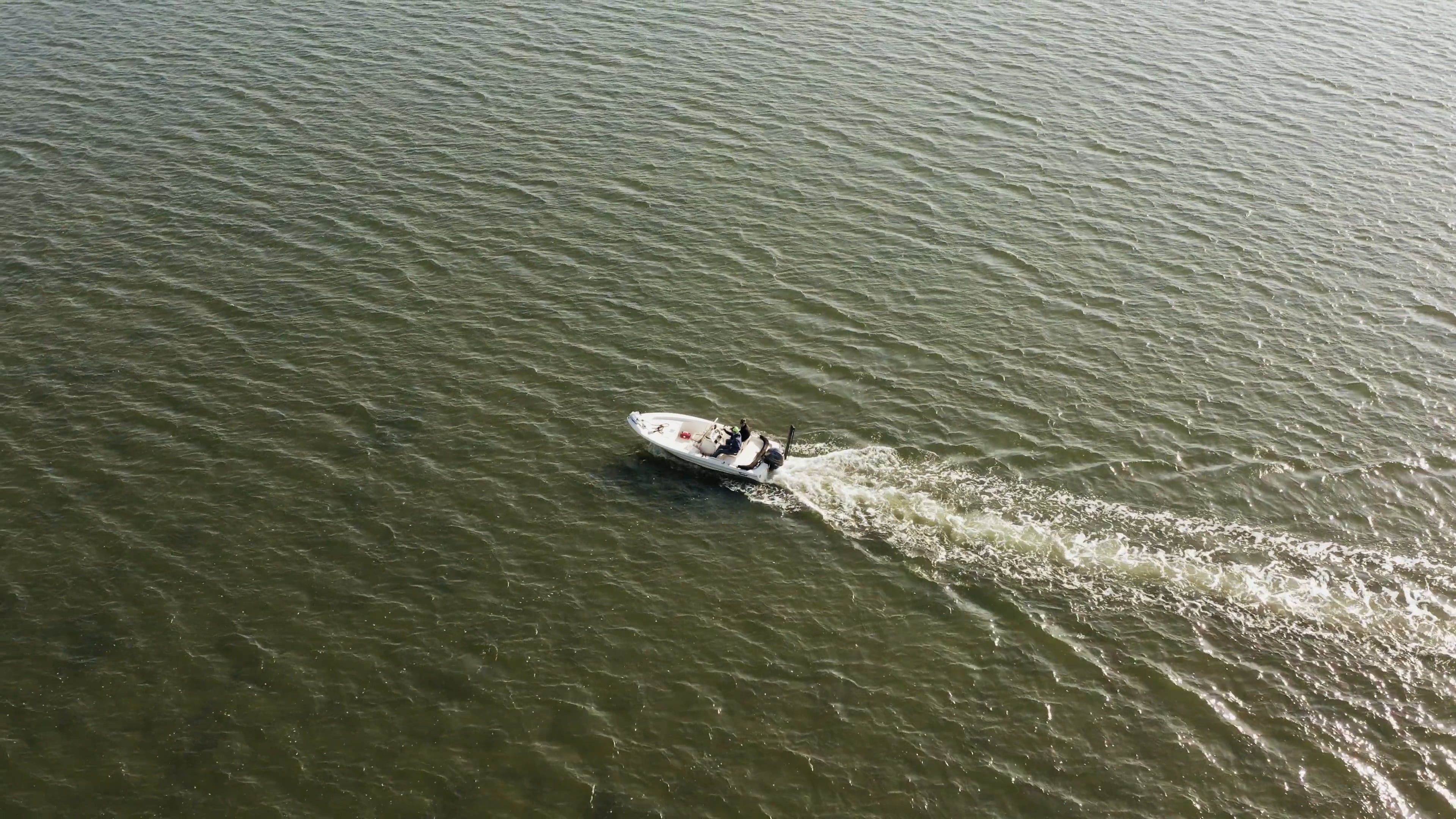 Motorboat Traveling Across A Body Of Water Free Stock Video Footage ...