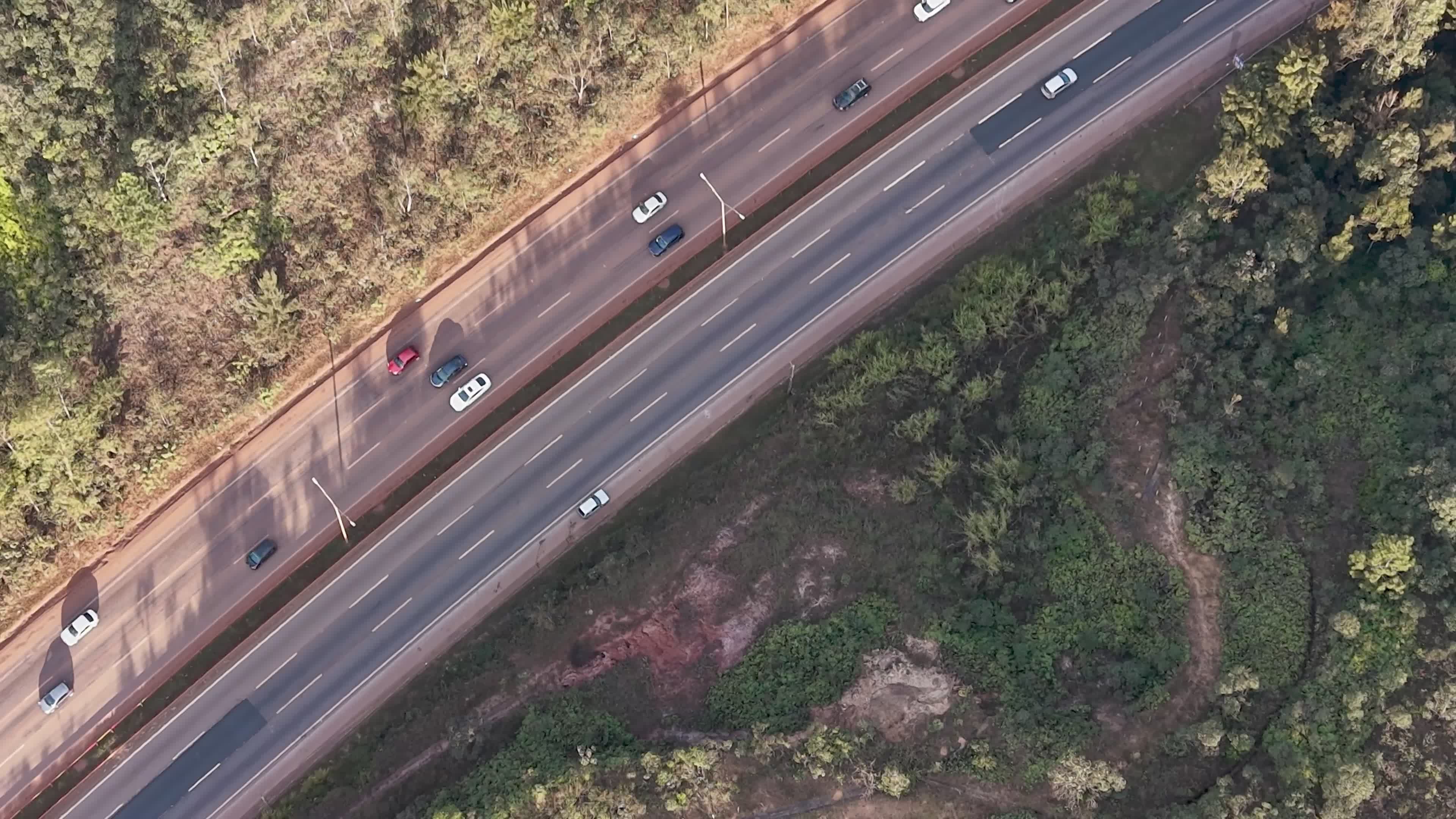 aerial view of highway through lush forest 38603538 — free pexels stock footage
