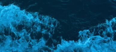 dramatic blue ocean waves from above