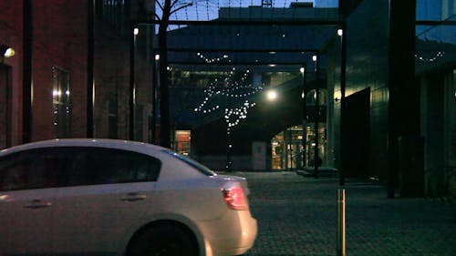 Cars Passing by in a Downtown Busy Road 