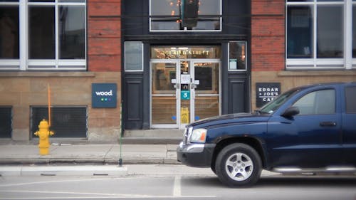 Cars Passing by in the Downtown City Road