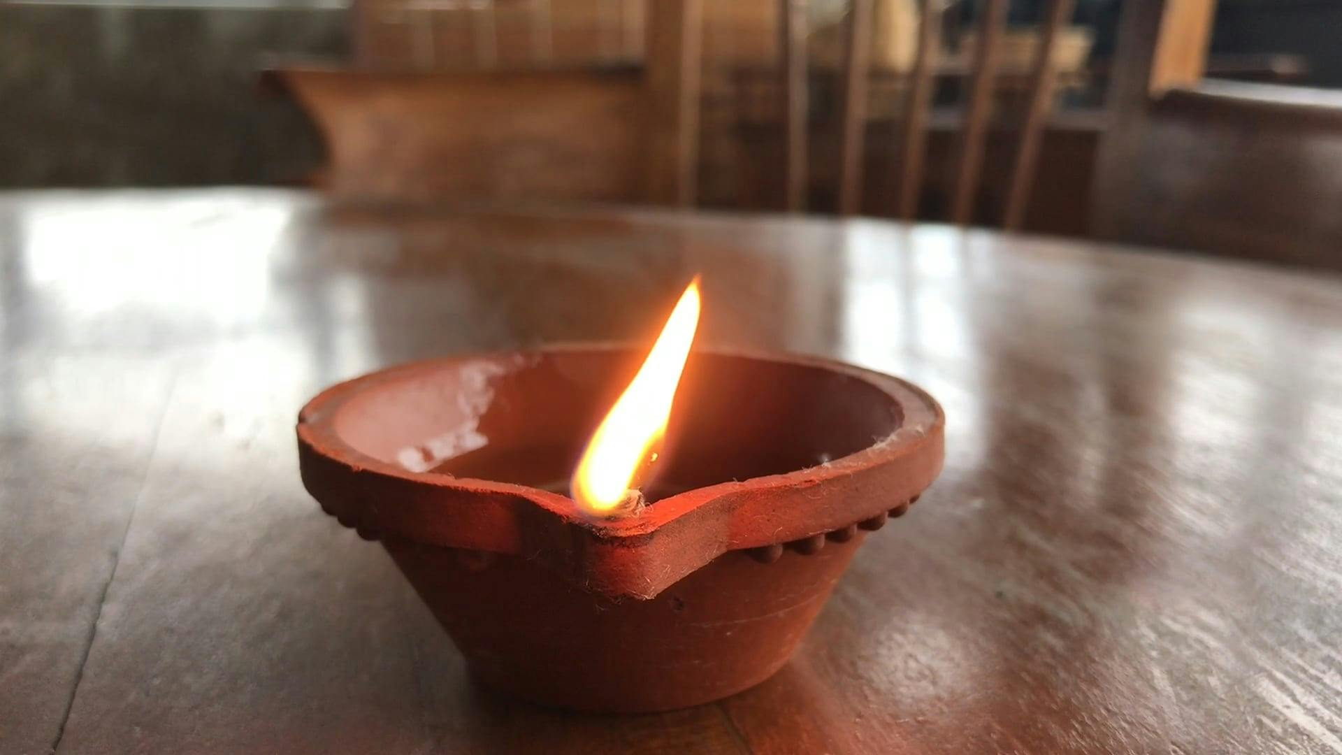 A Burning Floating Candle On A Clay Pot With Water · Free Stock Video