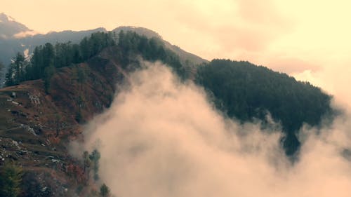 Drone Footage Of Thick Fog Creeping In The Mountain Side