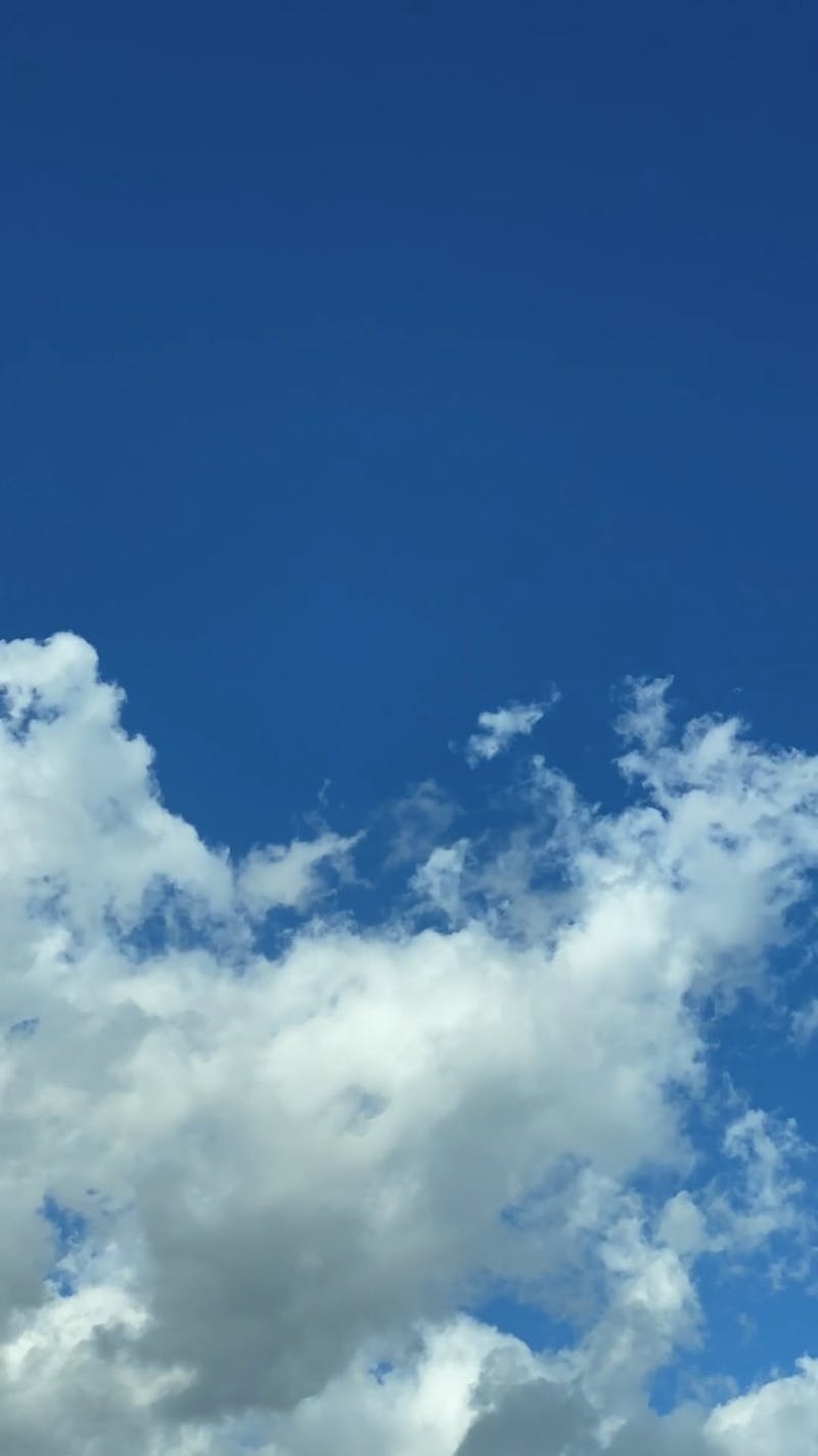 White Clouds Under A Blue Sky In Timelapse Mode Free Stock Video ...