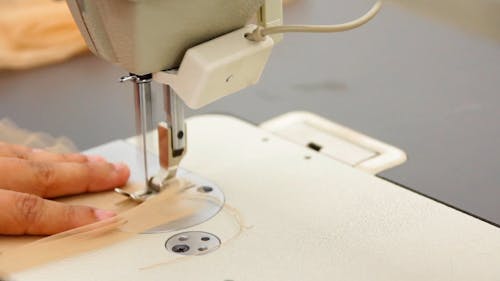 A Person Using a Sewing Machine 