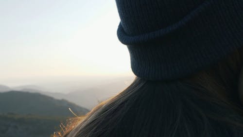 A Woman Enjoying Nature On A Mountain Top