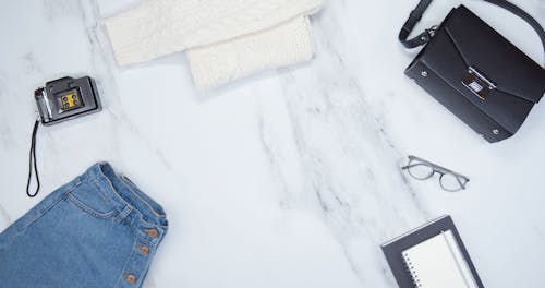 Personal Belongings Arranges Over  Marble Surface