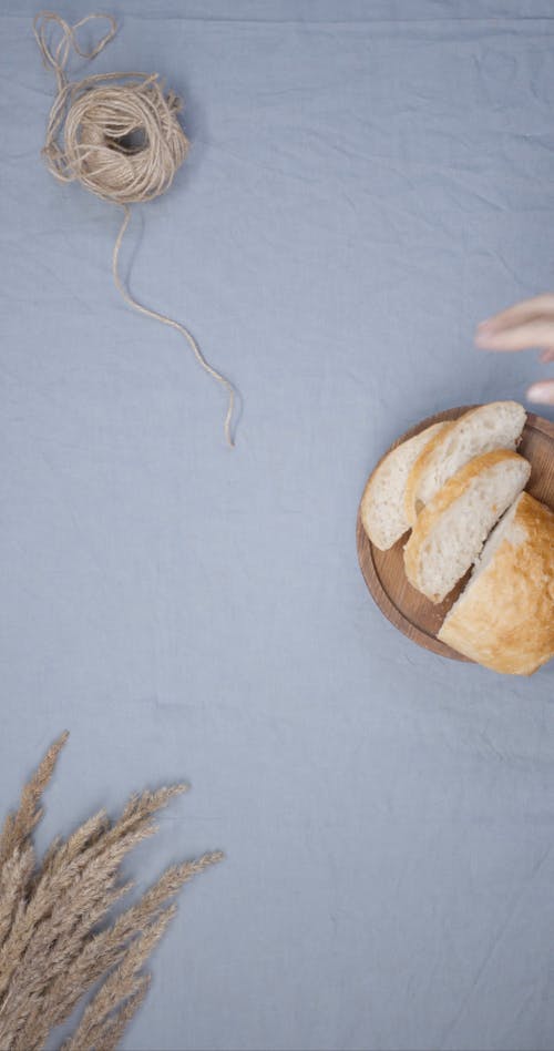 Slices Of Baguette Over A Wooden Tray