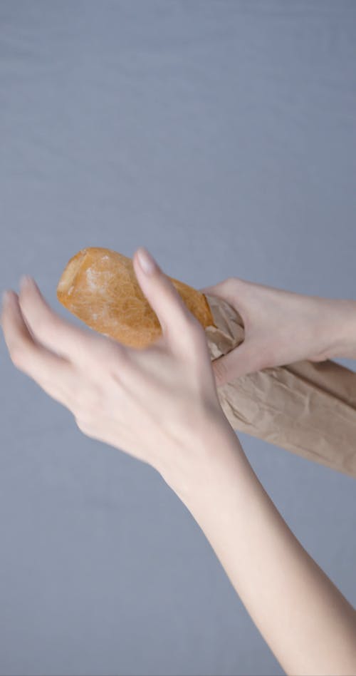 Cutting By Hand A Fresh French Bread