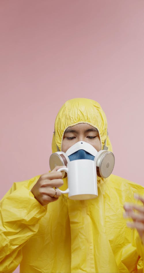 A Man Wearing Protective Suit And Anti-gas Mask