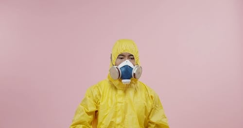 Man In Protective Suit Having A Drink