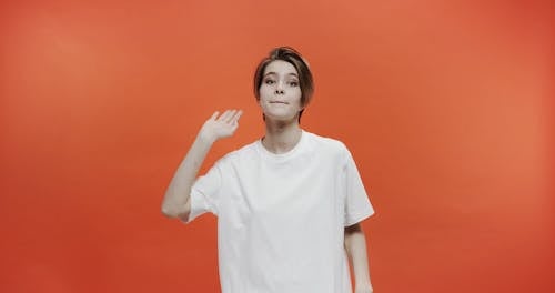 A Woman Indicating Number Five Through Hand Signals