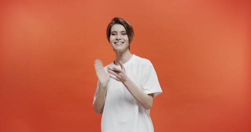 A Woman Clapping Hr Hands In A Positive Attitude