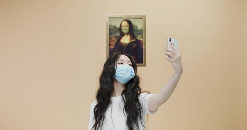 Woman With Face Mask Taking Selfie 