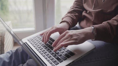 Person Typing on a Laptop