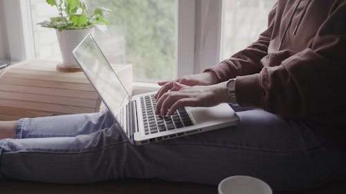 Person Using a Laptop at Home