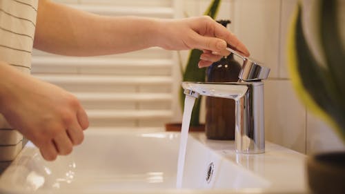 Person Washing Hands