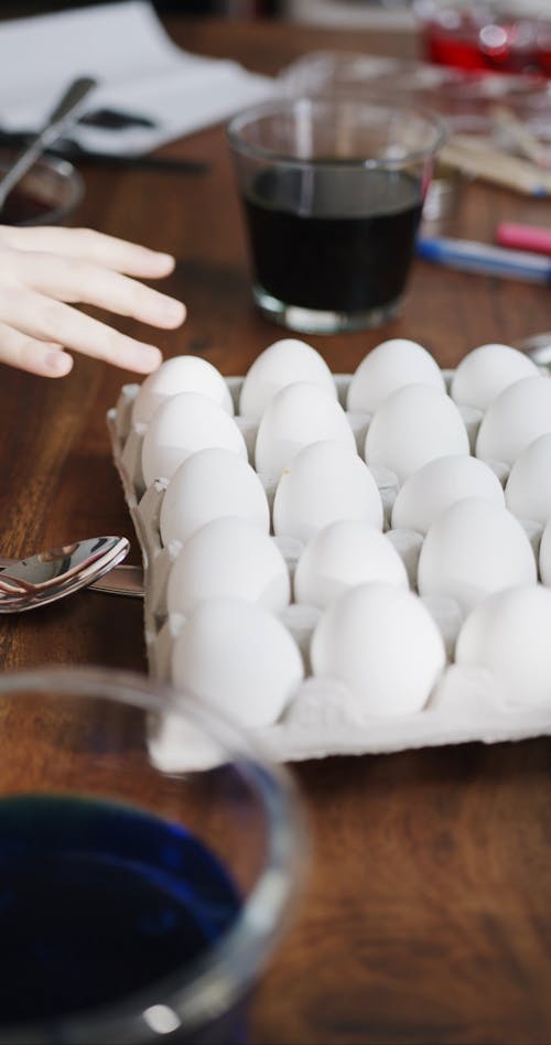 Picking Eggs From A  Filled Tray 