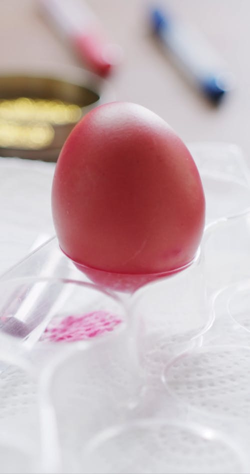 An Egg Dyed In Red Color