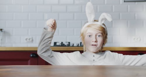 A Girl Goofing Around Wearing A Head Band Bunny 
