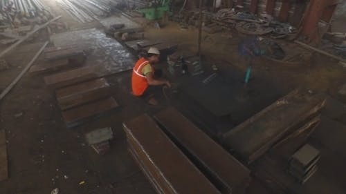 Person Grinding Metal