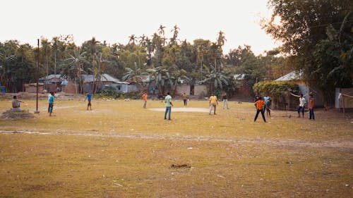 A Group Of Men Playing A Baseball Game