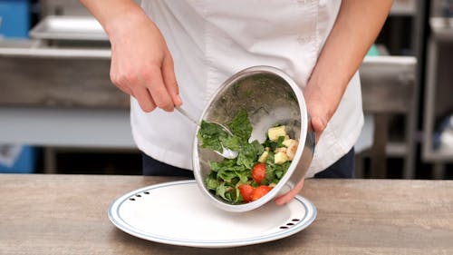 A Chef Preparing A Fresh Vegetable Salad