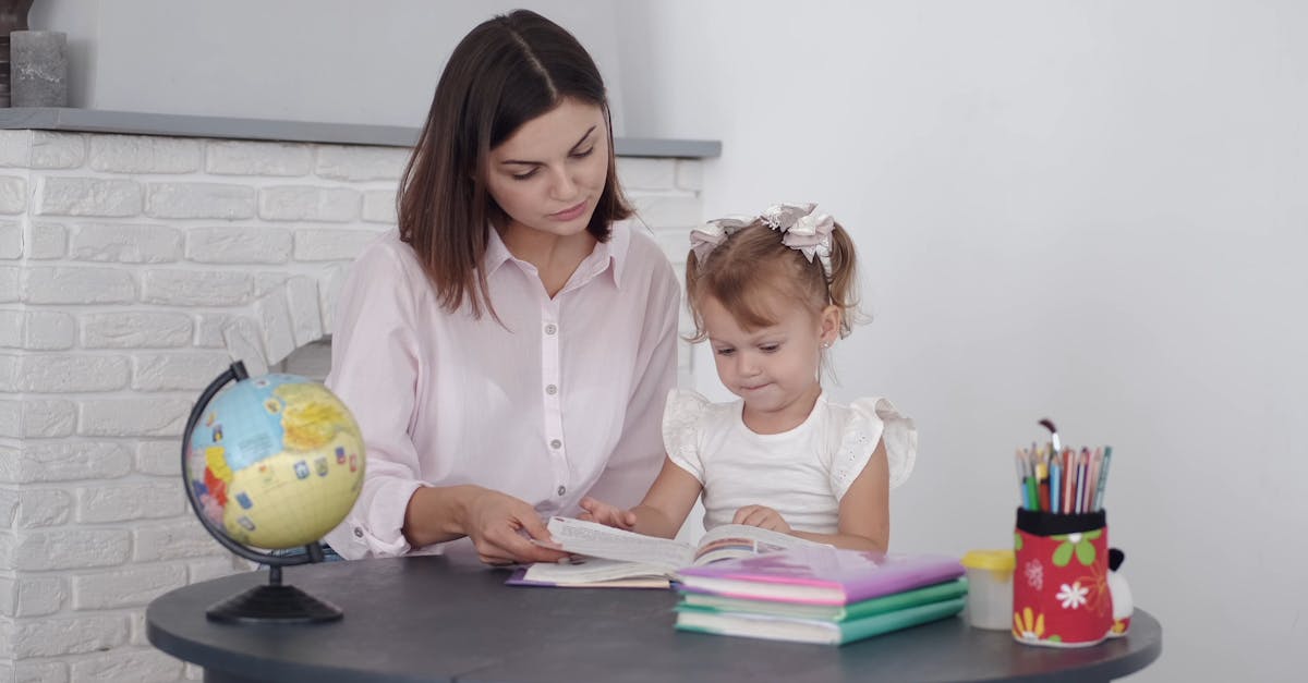 A Woman Teaching A Child To Read · Free Stock Video