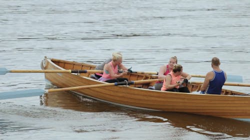 People Rowing a Rowboat