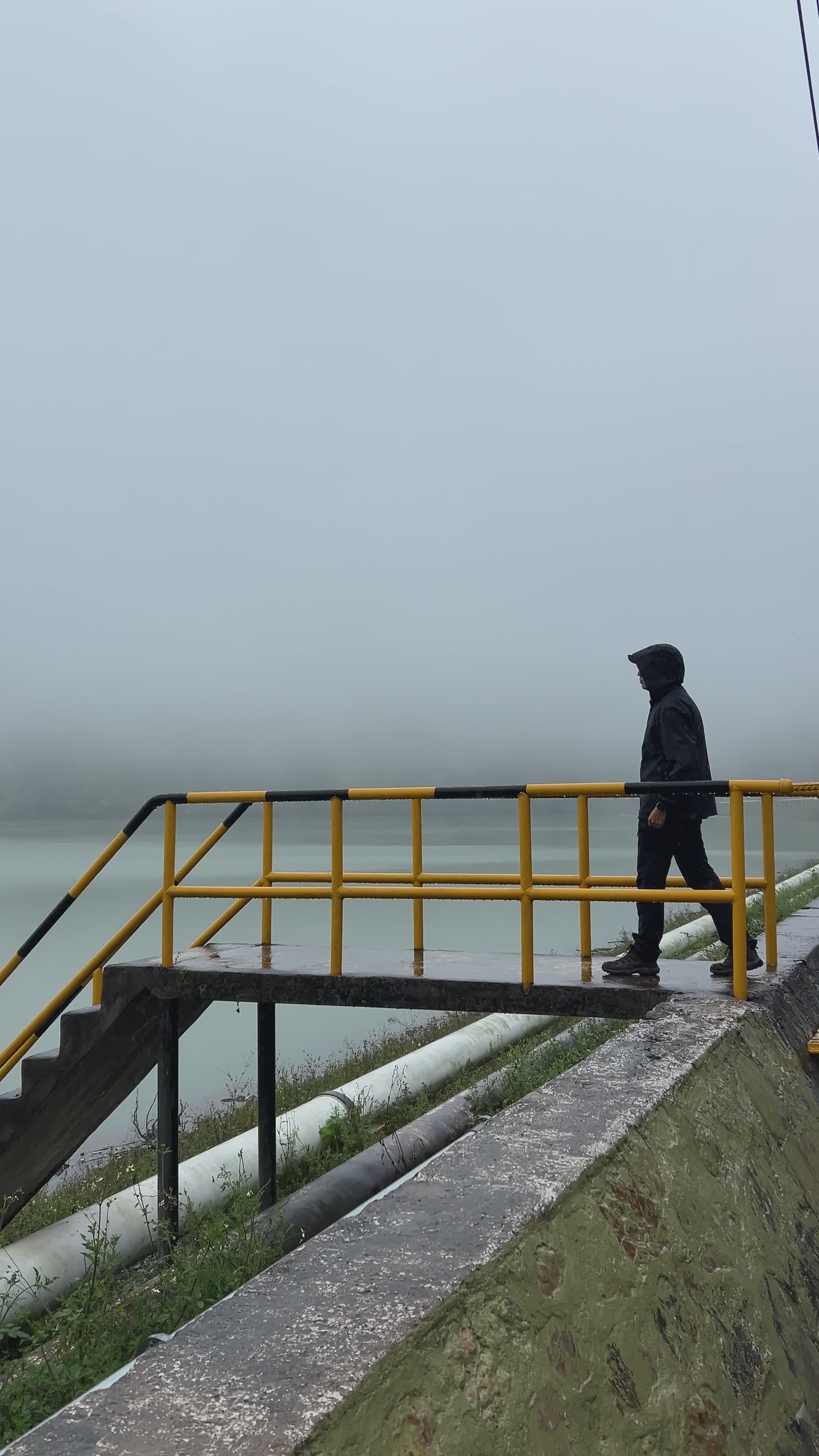 Person in Raincoat on Foggy Bridge Free Stock Video Footage, Royalty ...