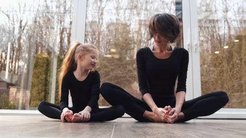 Mother and Daughter Doing Warm Up