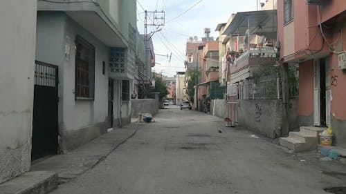 A Narrow Street In A Dense Neighborhood