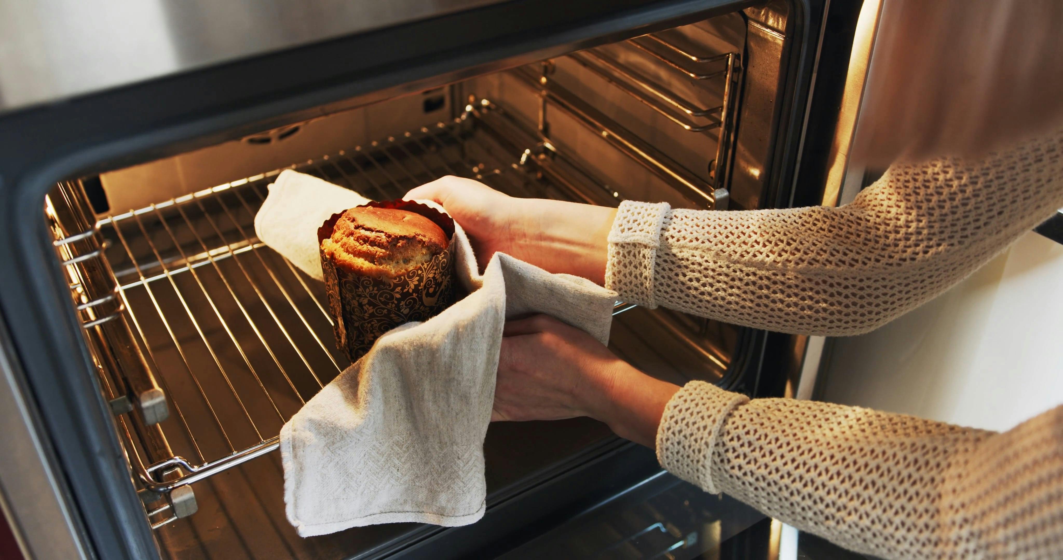 Removing From The Oven A Homemade Baked Cake · Free Stock Video