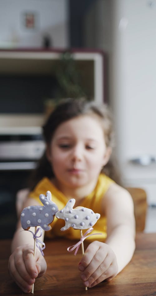 A Girl Playing With Easter Bunny Cake Decors