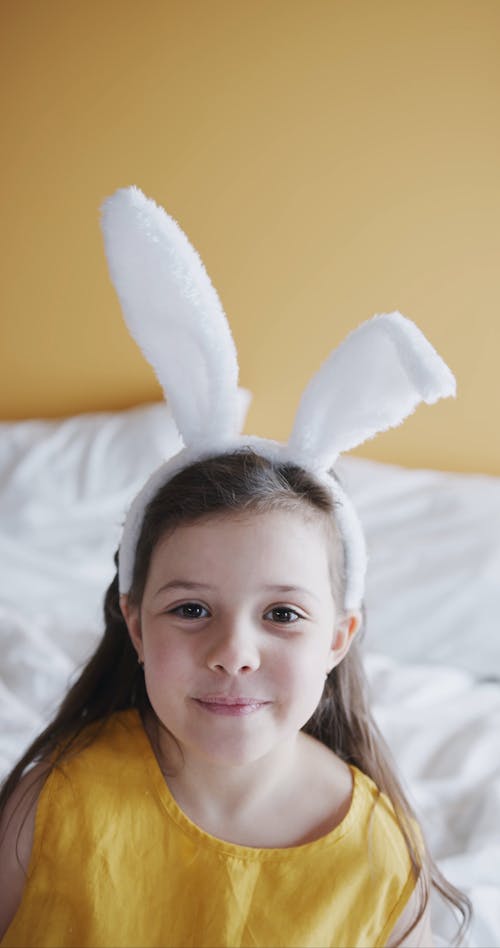 A Cute Girl Wearing An Easter Bunny Headband