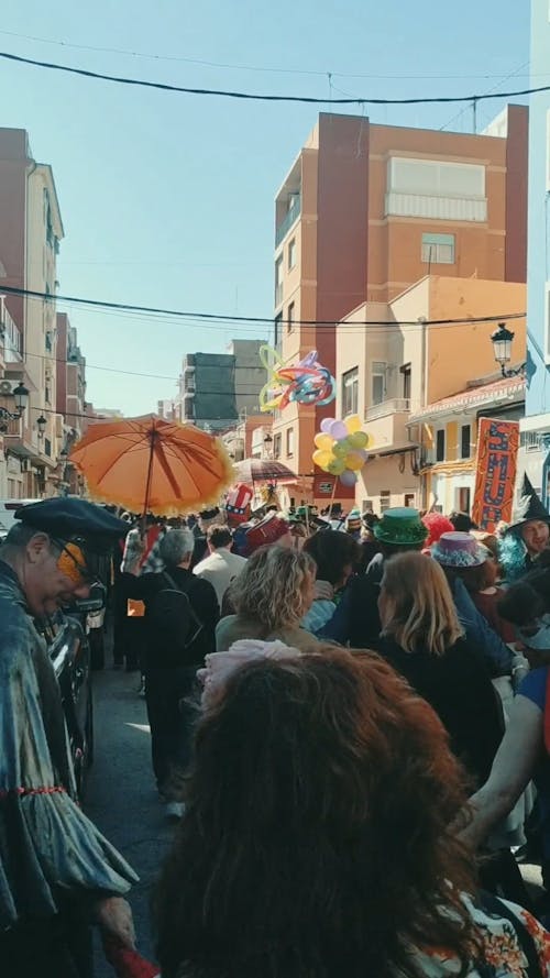 People Happily Participating In A Street Parade