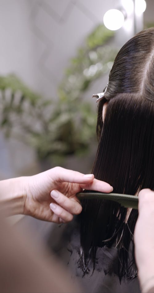 Trimming A Woman's Hair At The Back