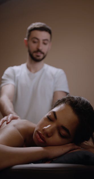 A Male Masseur Giving A Woman A Back Massage Free Stock Video
