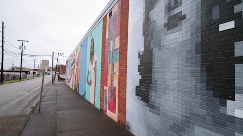 Street Art Paintings And Murals On The Brick Wall