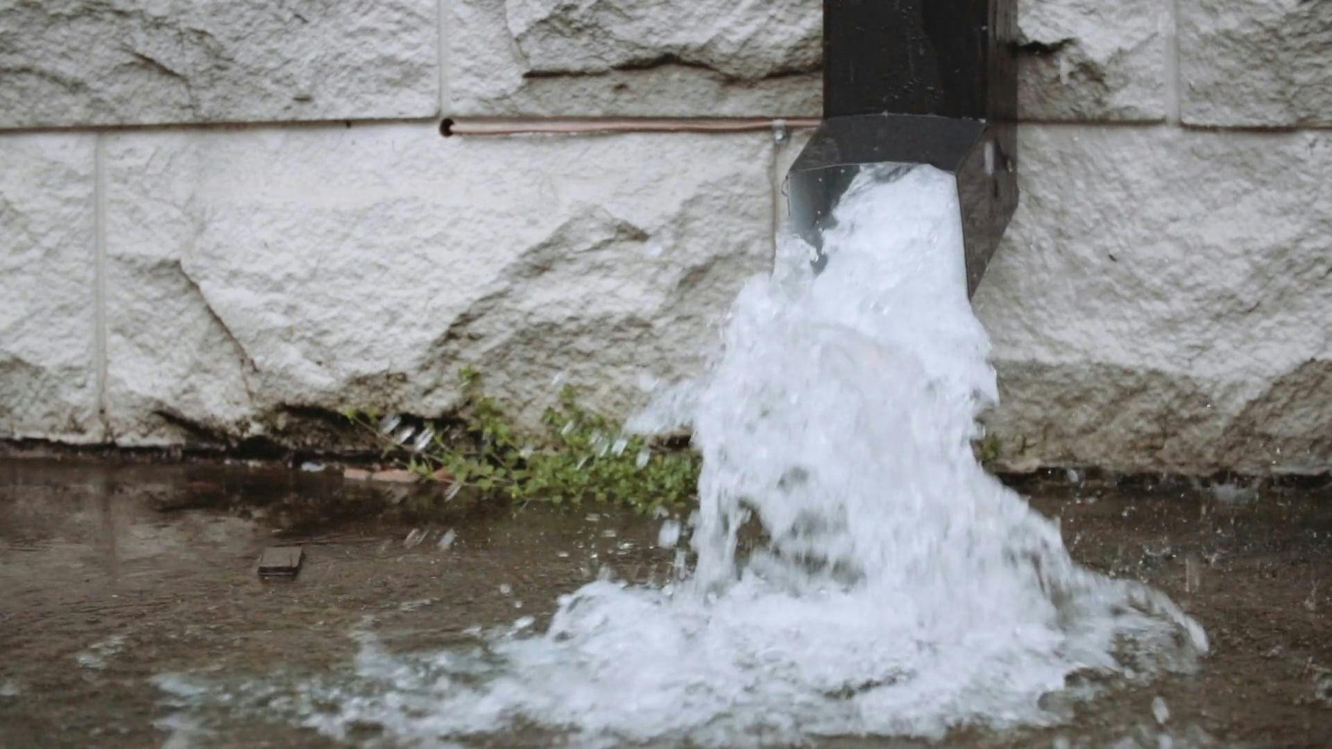 Close up of Water Flowing out of a Downspout · Free Stock Video