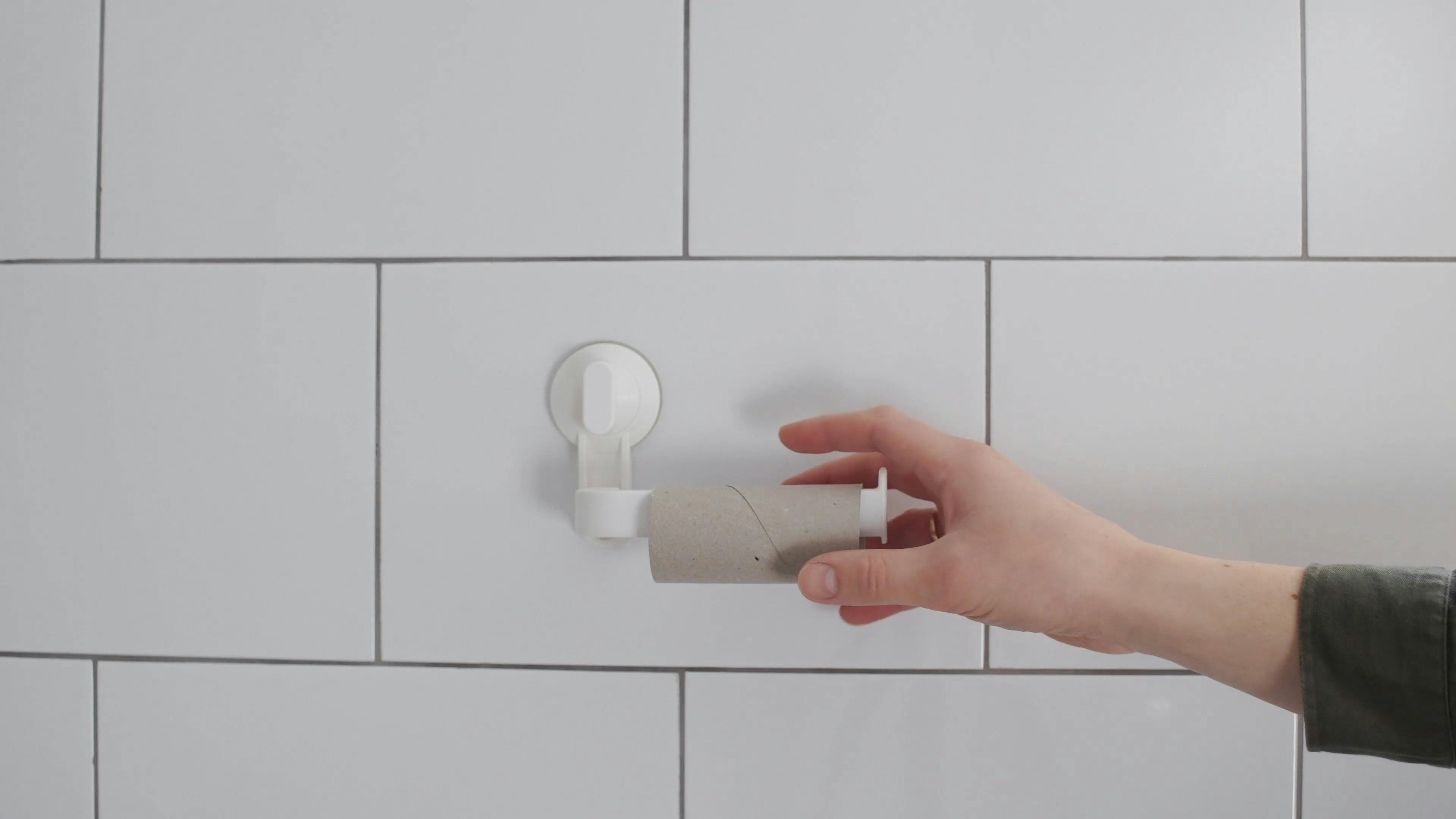 Person Changing a Toilet Paper Roll · Free Stock Video