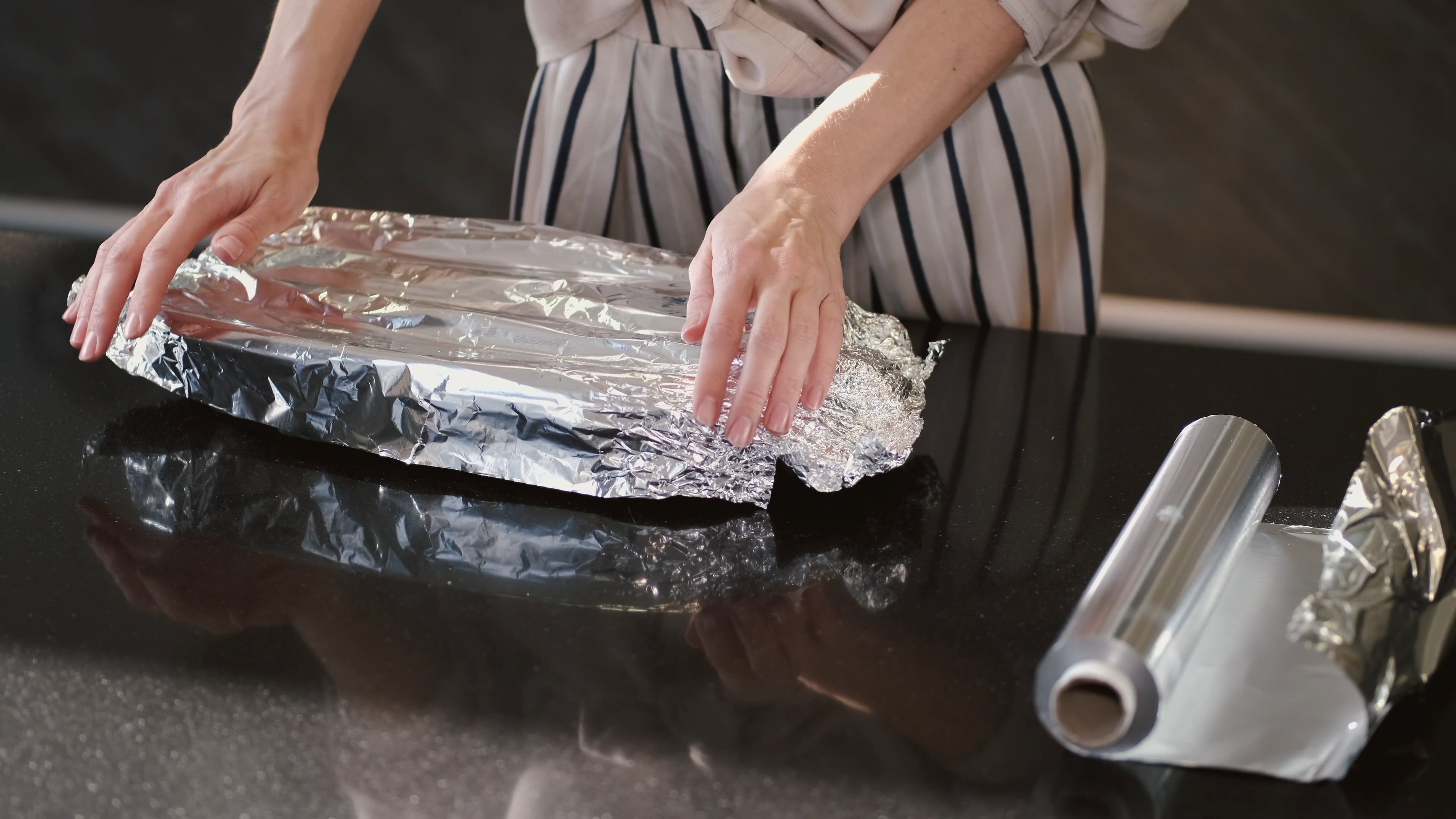 A Woman Wrapping the Plate with Foil Free Stock Video Footage, Royalty ...