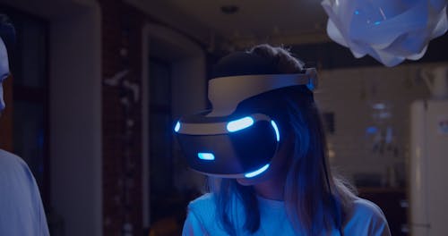 A Man Removing The Head Gear Of A Virtual Reality Game Console From Her Partners Head
