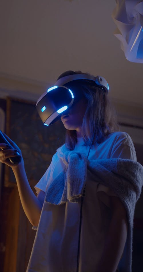 A Woman Playing With A Virtual Reality Game Console