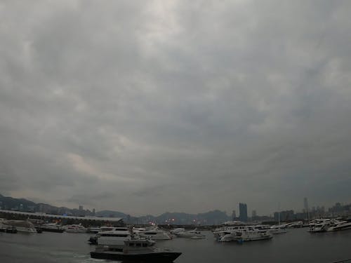 Watercrafts Under a Cloudy Sky