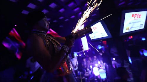 A Man in the Club Grinding a Metal Bar