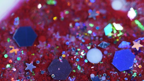 Close up of Glitters in Colored Liquid