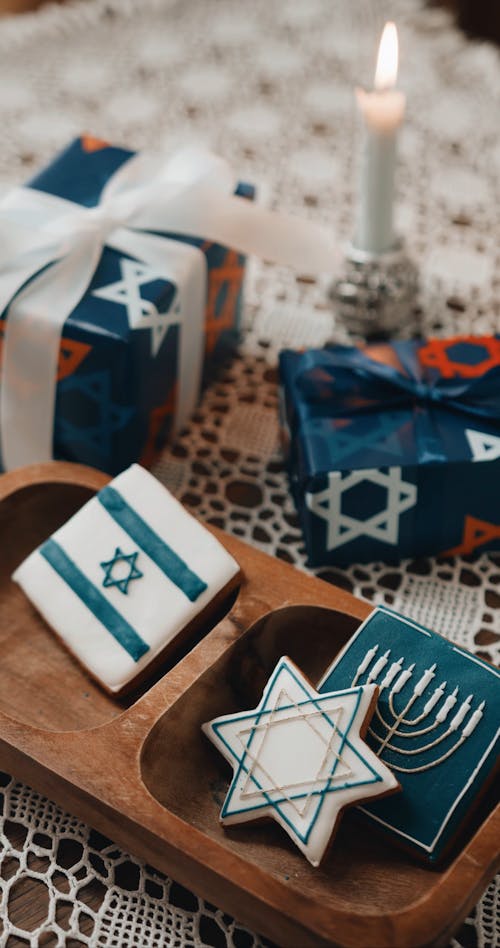 Arranging Hannukah Cookies On A Wooden Tray