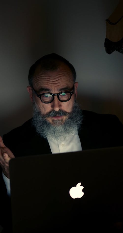 A Jewish Man Using A Laptop