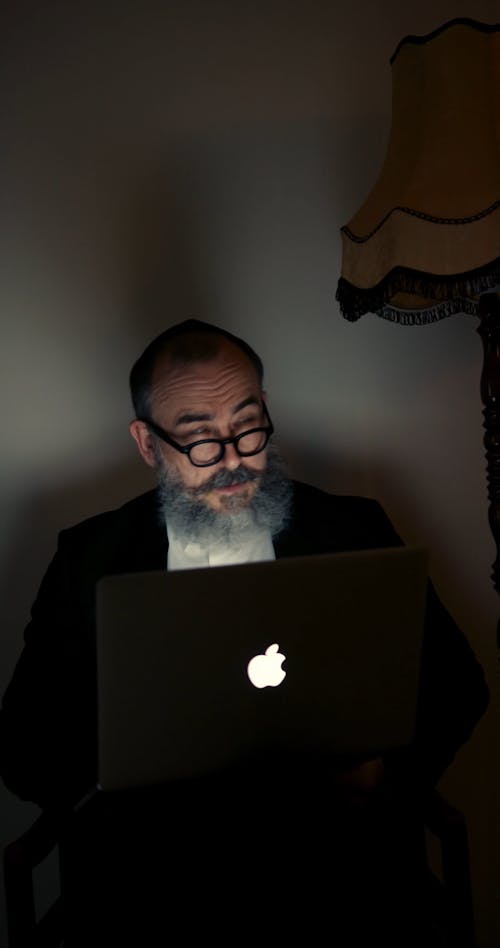 A Jewish Man Working With A Laptop